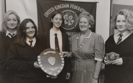 GATHER: A trio of sixth formers beat five other teams to win the Kendal heat of the Business and Professional Women’s Club schools public speaking contest in 1993. Kendal club president Beryl Greenwood is pictured presenting the award